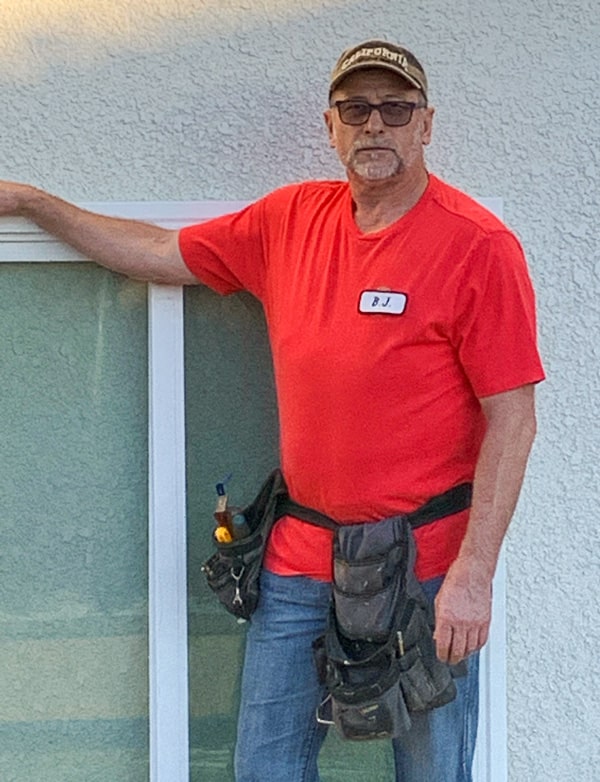 Window installer working on residential window replacement project in Vacaville