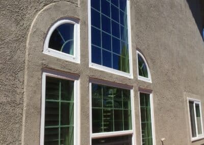 arched window replacement installed on modern home exterior