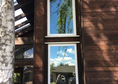 modern vertical window installation on custom home